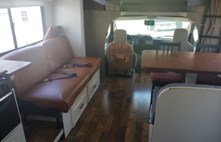 Remodeled main cabin with added storage and oversized table. The couch folds down to a twin size bed.