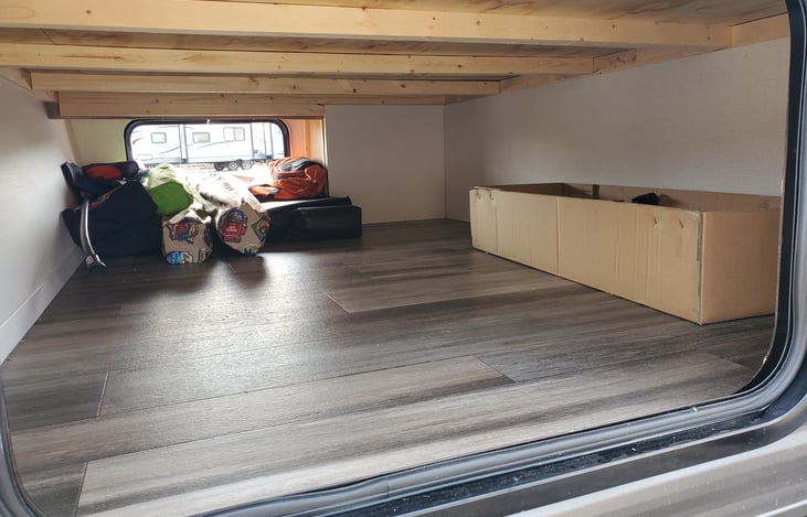 Outside storage accessible from inside under bed