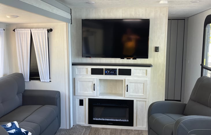 50in TV/dvd player, radio/blue tooth with electric fireplace.