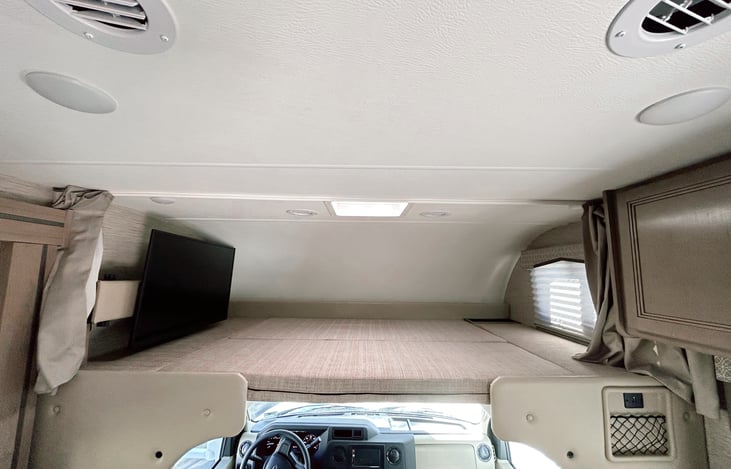 Queen sized bed above the cabin. Ladder is stowed away but easy to install!