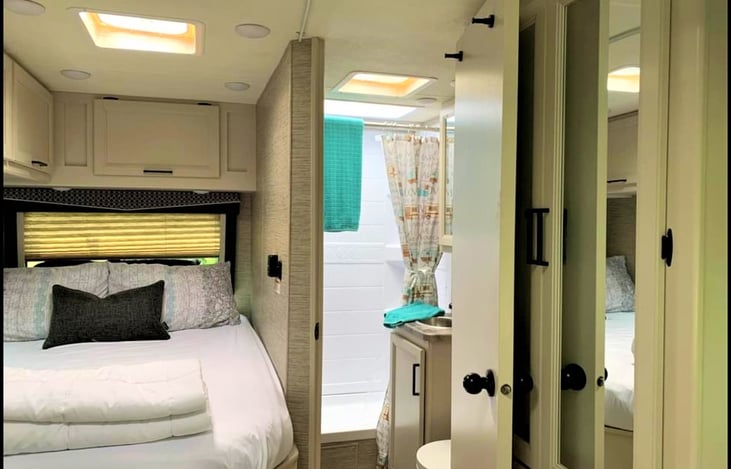 Cozy farmhouse interior! here is a view of the master bedroom and bathroom.