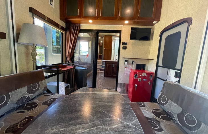 Garage viewing forward w/table set up. Upper bunk raised.