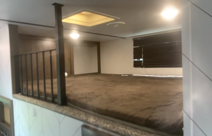 Mid-bunk for sleeping or storage.