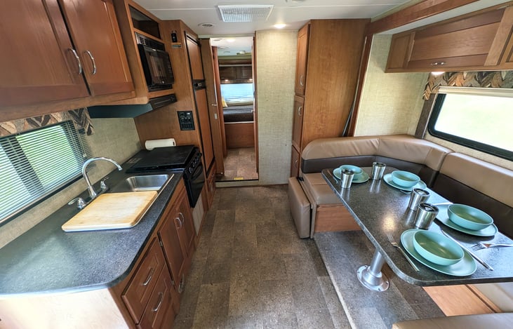 Cozy and spacious floor plan will ensure everyone is comfortable in this RV. Fully stocked kitchen, plenty of storage, swiveling captain's chairs and more.