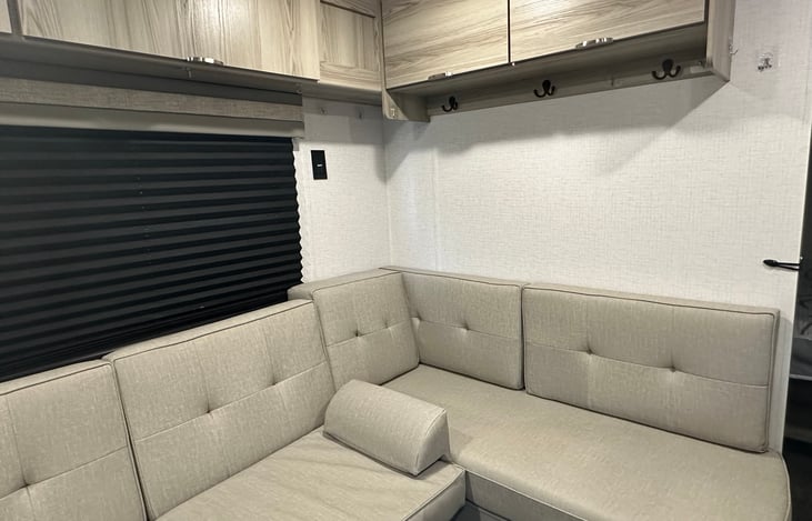 Living room U shaped couch with fold down futon bed.
