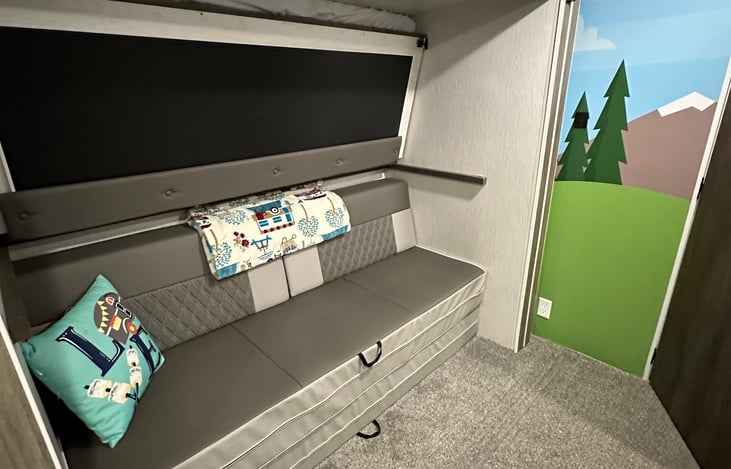 Back bunkroom- queen and 3 twins beds, TV, bean bag chair, own AC unit
