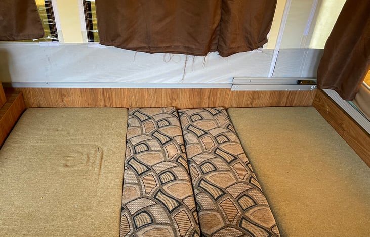 The dinette folded down for a bed.