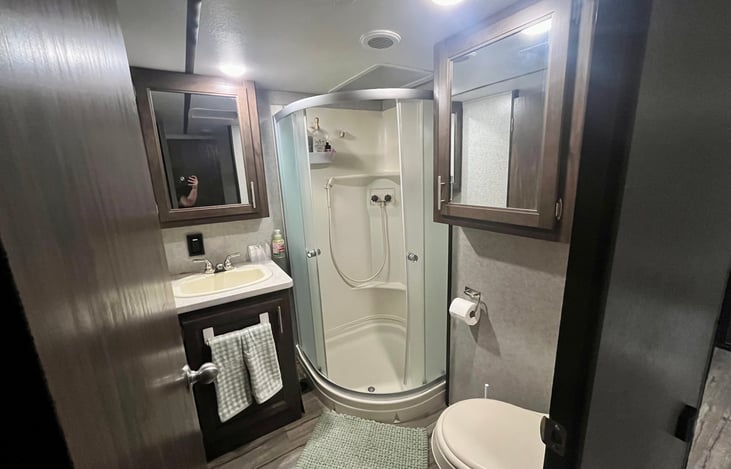 Bathroom with shower, sink, and toilet. Comes with towels, shampoo, conditioner and soap you can use.