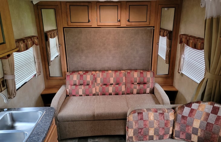 Couch that turns into bed.  Queen murphy bed that folds down onto couch