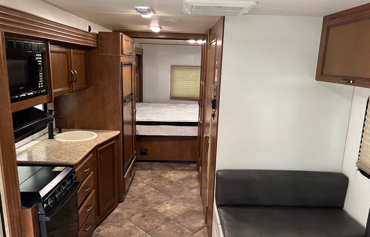 Open area with plenty of storage and sleeping area for another guest.