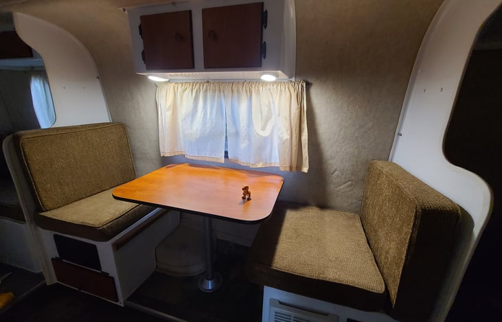 Couples dining area, can be lowered for an extra bed