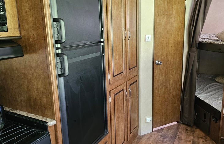 Frig and freezer, cabinet with dishes, pots, pans, silver wear and all you need for a great camping experience on our 52 acre sheep farm!