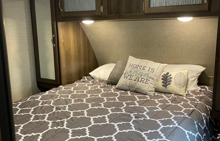 Queen bed in a private room. This bed is extra comfy. We put a real mattress on here, no springy camper mattresses here!