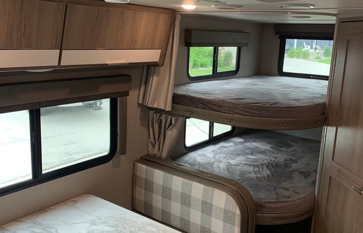 Full size bunks and the dinette makes a bed.