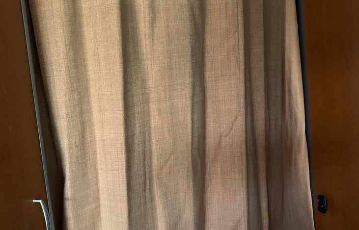 Privacy curtain goes around back bed