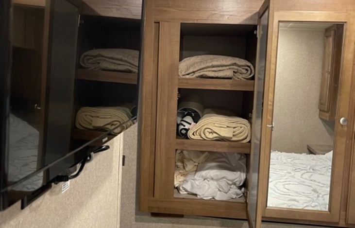 Master bedroom cabinet and TV.