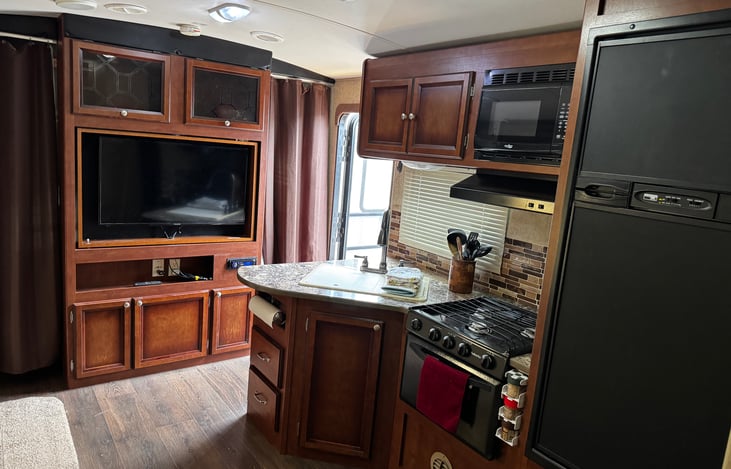 Entertainment center-comes with Newly replace TV, Blu-ray player, and radio. Selective movies have been provided.