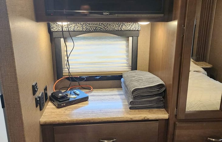 Tv with DVD player.  Flip up the TV to hidden storage for your valuables.