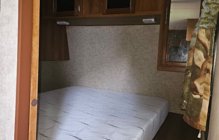 Master bedroom with privacy sliding door. Queen bed.