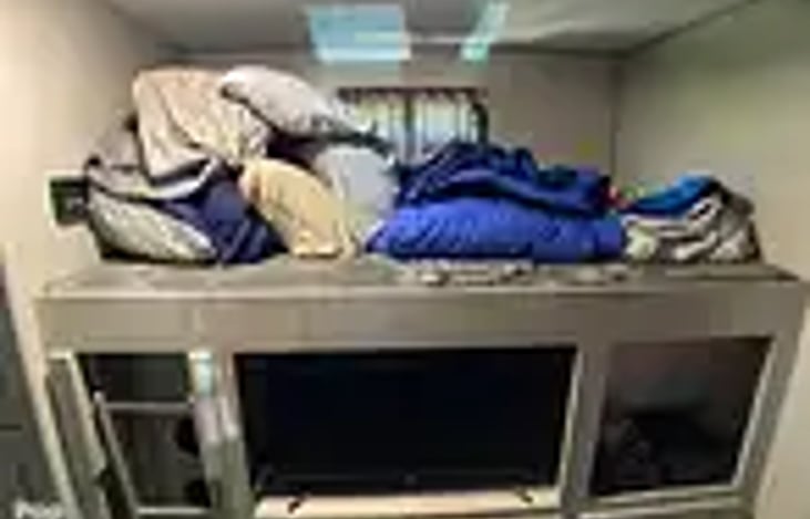 Back bunk room with TV