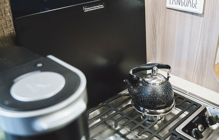 A Keurig comes standard w/ complementary coffee, creamer, and sugar. Tea kettle also included.