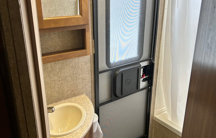 Door to exterior from bathroom