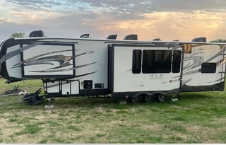 42’ Luxury Toyhauler with rare Side Patio