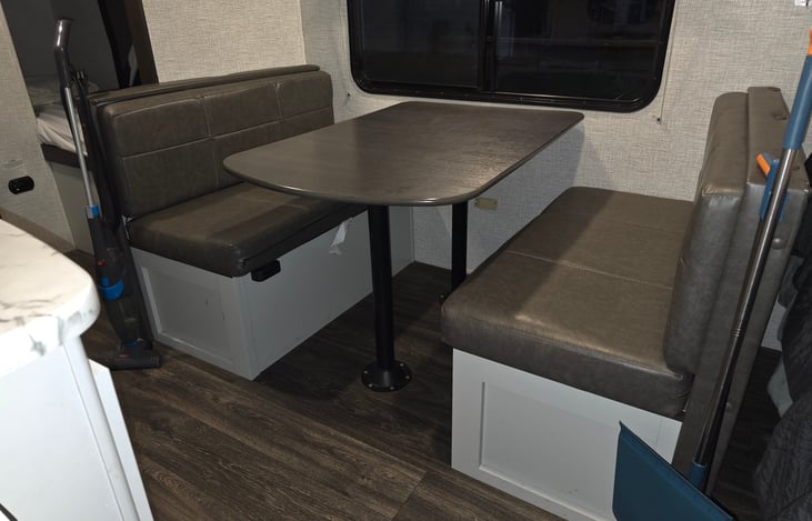 Fold down table for extra bed. Plus vacuum and broom included