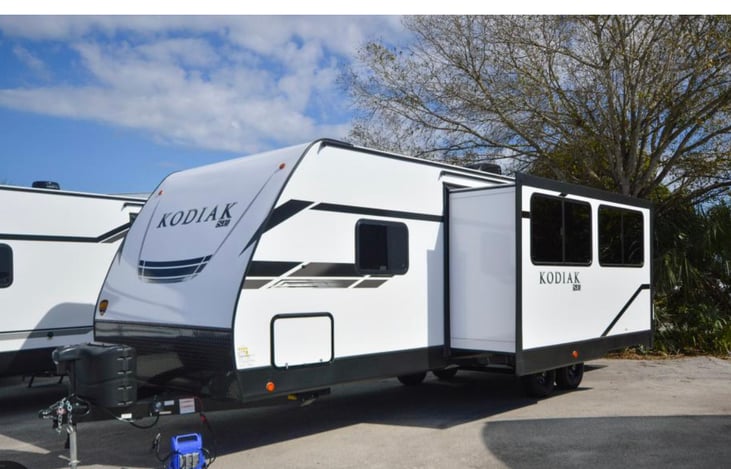 Outdoor Refrigerator located in small door in photo