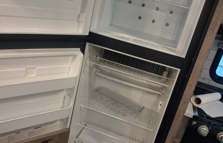 The fridge and freezer. There is also a oversized mini fridge in the outdoor cooking station.