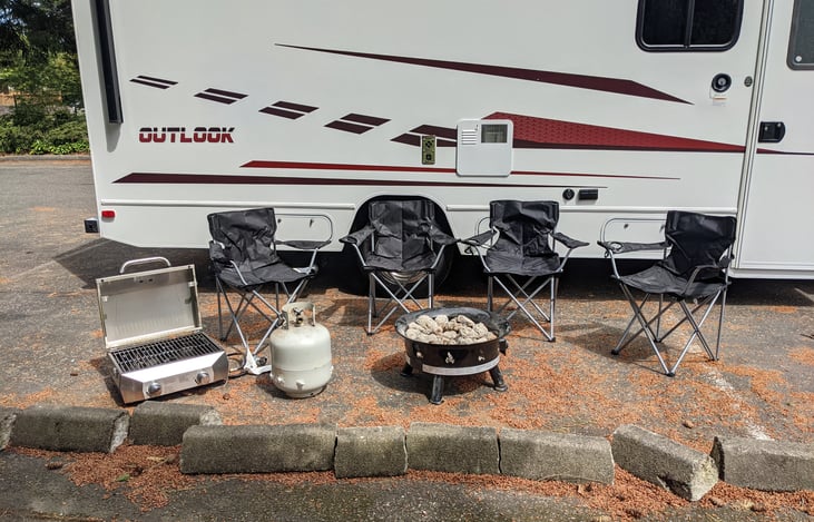 4 Chairs, BBQ, Firepit, & Tank included in rental!