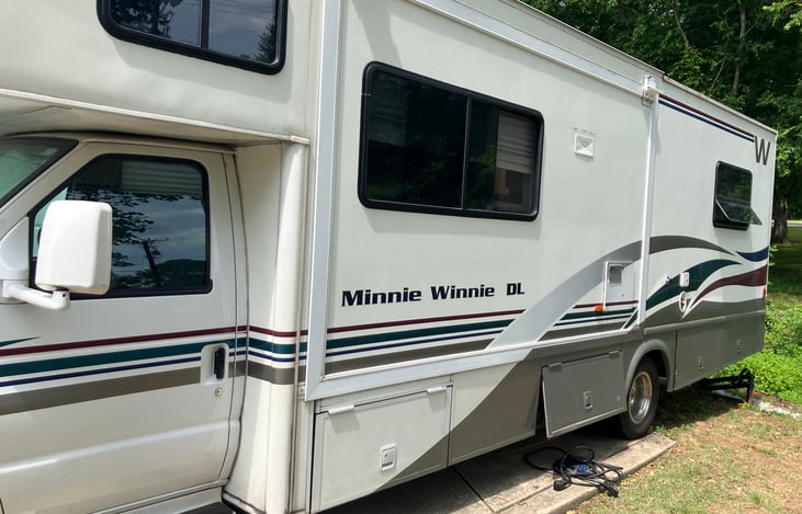 Class c RV with plenty of storage underneath. Comes with chairs, tools, 12x12 pop up canopy and more!