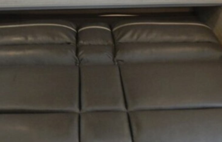 Couch goes flat and Murphy Queen Bed drops down.