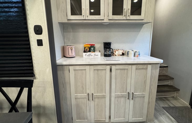 Coffee Bar - A few cleaning supplies in the bottom cabinets