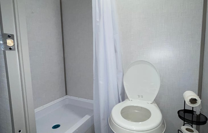 Bathroom shower and toilet.