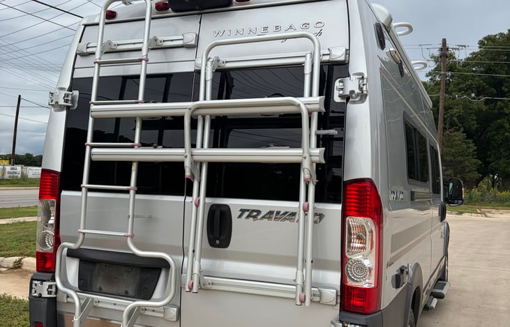 Double bike rack on the back. There is also a 2 inch receiver. Let us know if you would like to borrow a tray for the back to carry a cooler, or any of your other fun travel items.