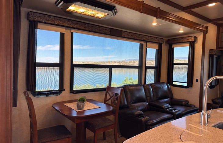 Reclining Love seat, kitchen table has an insert plus 2 additional chairs stored in closet