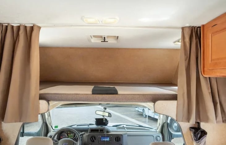 Extra sleeping space above the cab makes this Thor Majestic 28A perfect for families — a Las Vegas RV rental that sleeps 6 and welcomes pets