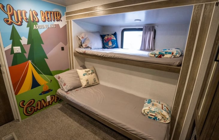 Back bunkroom- queen and 3 twins beds, TV, bean bag chair, own AC unit