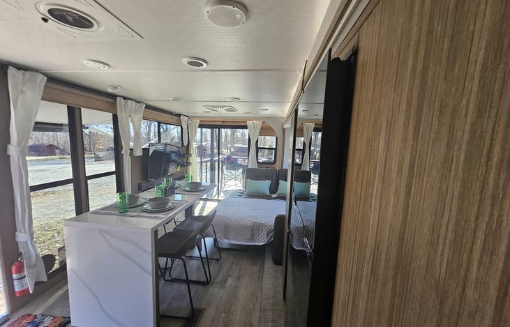 View of living area with couch converted to bed