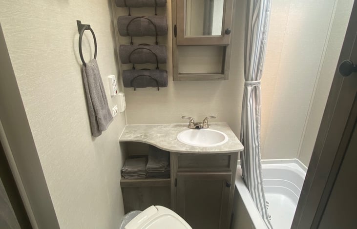 Toilet, sink and shower included.