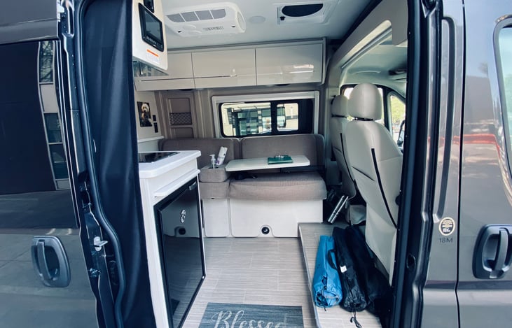 RV comes with folding chairs and table