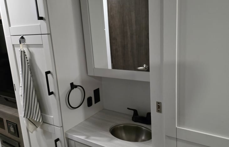 Bathroom sink and medicine cabinet