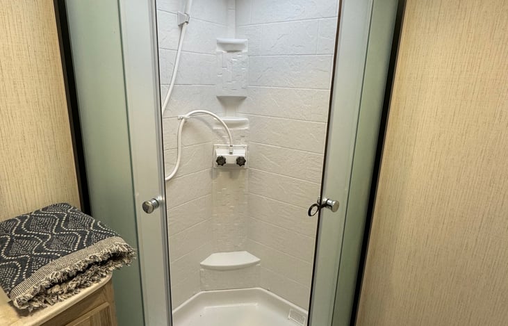 The spacious shower with skylight.