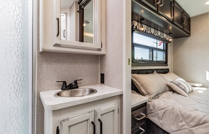 View of master bedroom from bathroom.