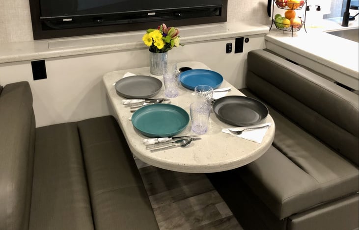 Comfortable seating for a table of four. This area also converts to a small twin size bed if needed.