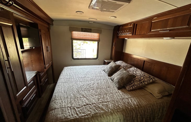 Mast room with king bed, tv, 2 closets, private central a/c and heat, lots of storage, hat hangers, cubbies, and outlets for small bedside items.