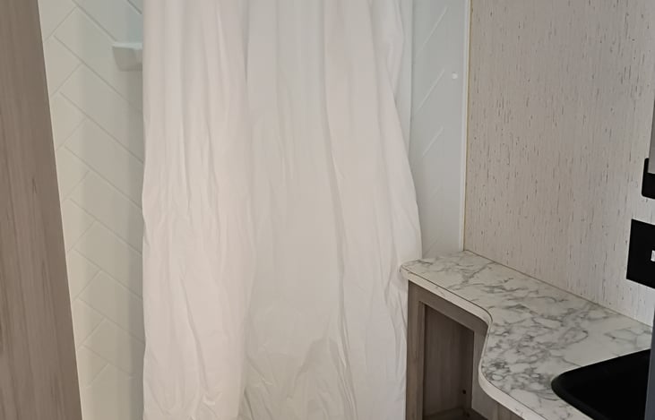 Shower and toilet and sink area.