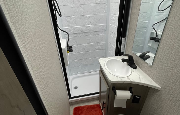 Bathroom with toilet, shower and sink