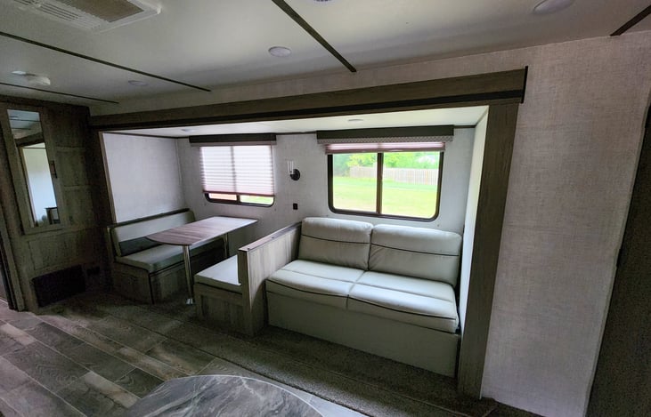 Booth and love seat can both be used as additional sleeping areas, all of the seats have storage underneath.